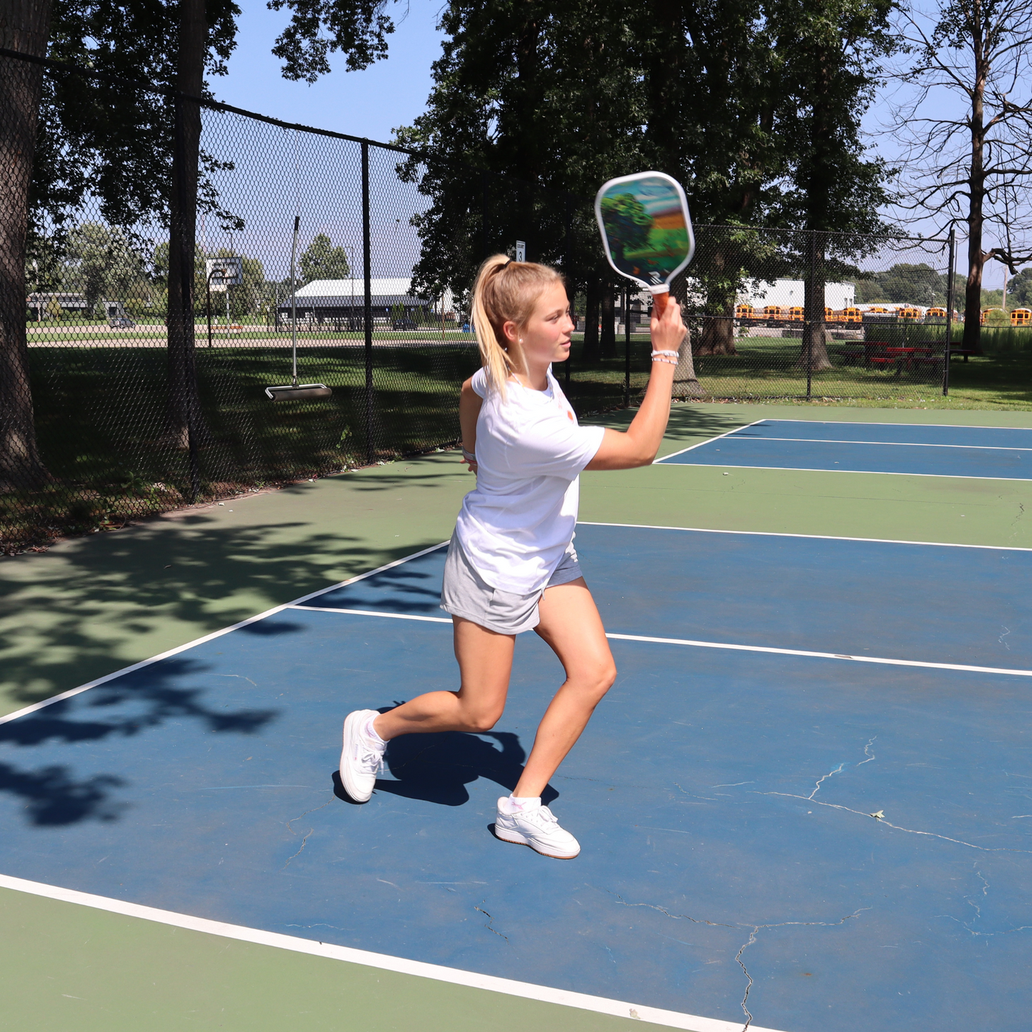 Peach pickleball paddle in use backside