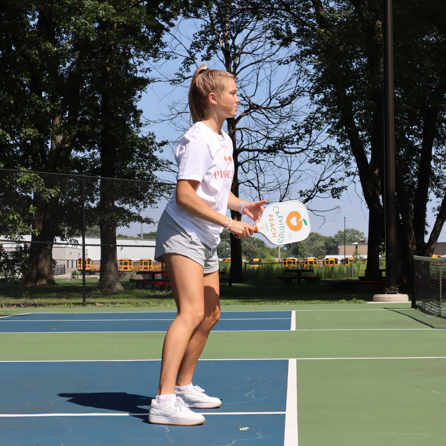 Peach pickleball paddle in use front side